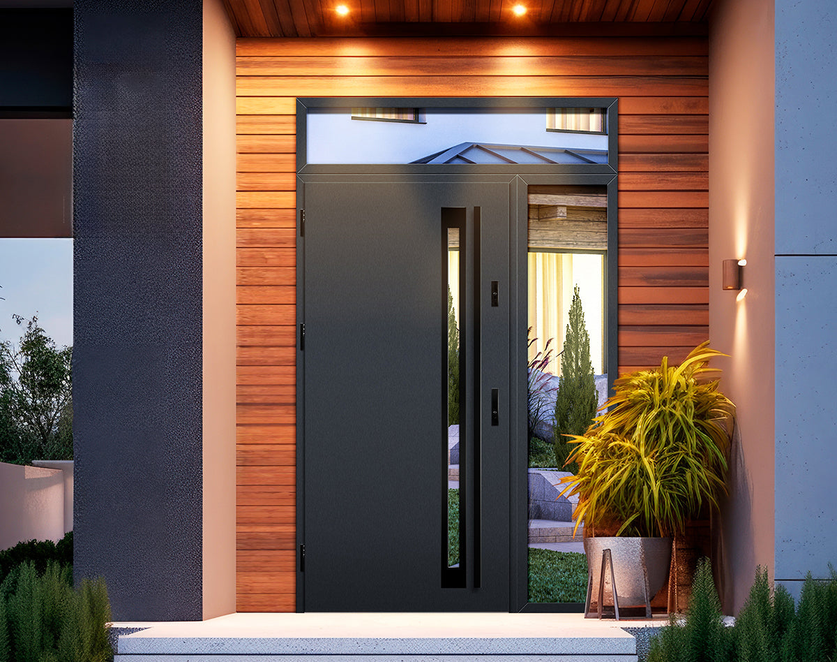Modern steel front door set with vertical glass panels, transom window above, and warm exterior lighting, framed by horizontal wood cladding and contemporary landscaping.