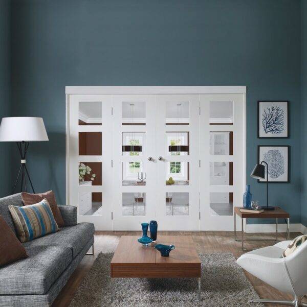 Modern living room with gray sofa, wooden coffee table, and white walls.