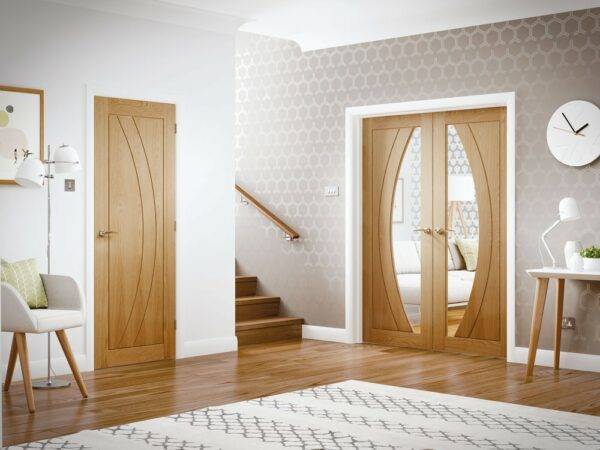 Modern interior design with wooden doors and patterned wallpaper.