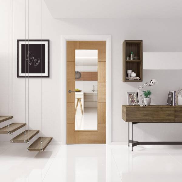 Modern interior design with wooden door, floating shelves, and a desk.