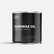 Can of hardwax oil with 'Lpd' branding on a white background