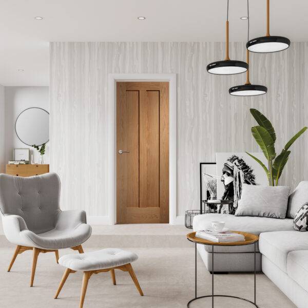 Modern living room with gray armchair, white sofa, and wooden coffee table.