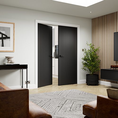 Modern interior with black doors, furniture, and decor elements.