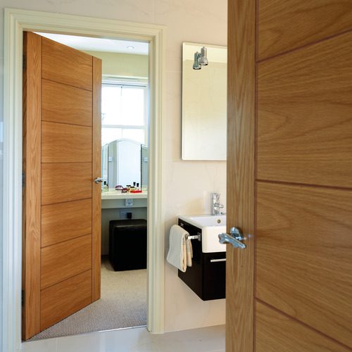 OAK PALOMINO FINISHED 7 PANEL LADDER STYLE FIRE DOOR