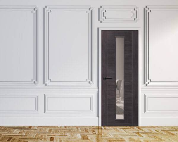 Dark wooden door with a mirror insert in a room with white paneled walls and wooden floor.