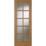 Wooden door with glass panels on a white background