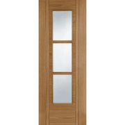 Wooden door with three glass panels on a white background