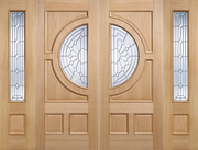 Wooden door with decorative glass panels, sidelights. 