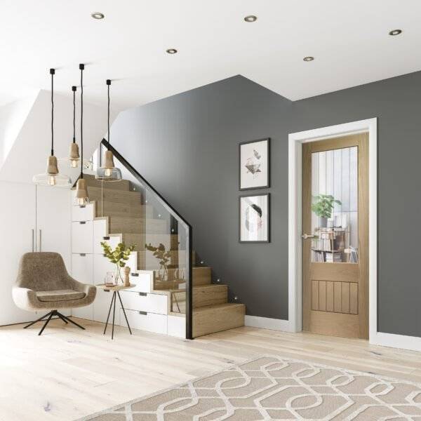 Modern interior design of a staircase and living area with gray walls, wooden floor, and decorative elements.
