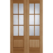 Wooden door with glass panels on a white background