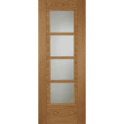 Wooden door with four glass panels on a white background