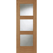 Wooden door with three glass panels on a white background