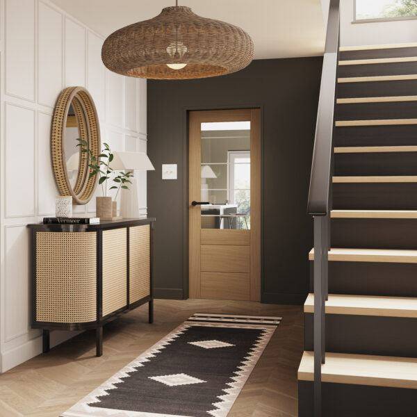 Modern interior with a staircase, console table, and open door.