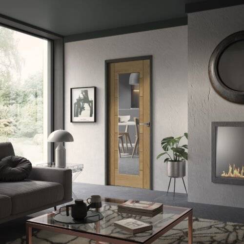 Modern living room with a glass door leading to a dining area.