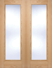 Wooden door with glass panels on a white background