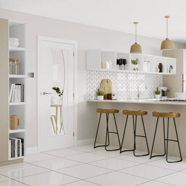 Modern kitchen with white cabinets, marble backsplash, and wooden stools.