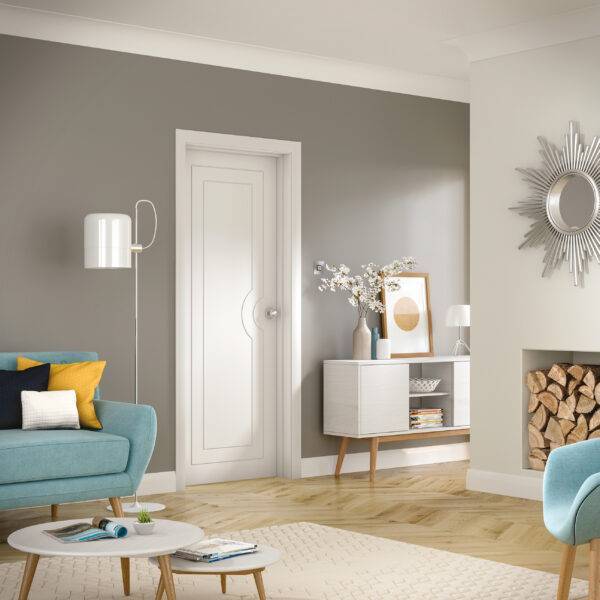 Modern living room with gray walls, a white door, and decorative elements.
