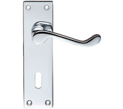 Chrome door handle and plate on a white background