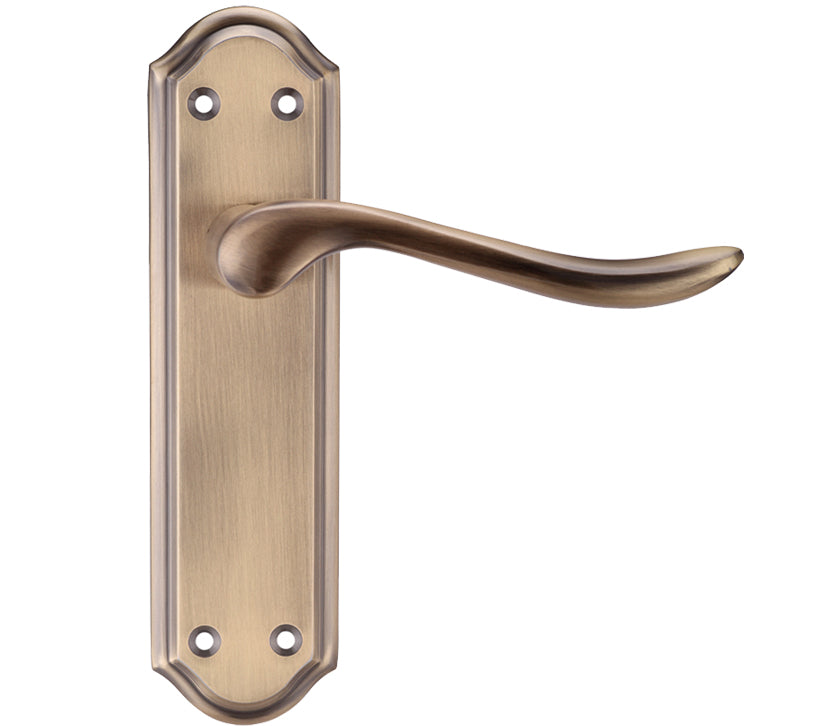 Brass door handle on a white background
