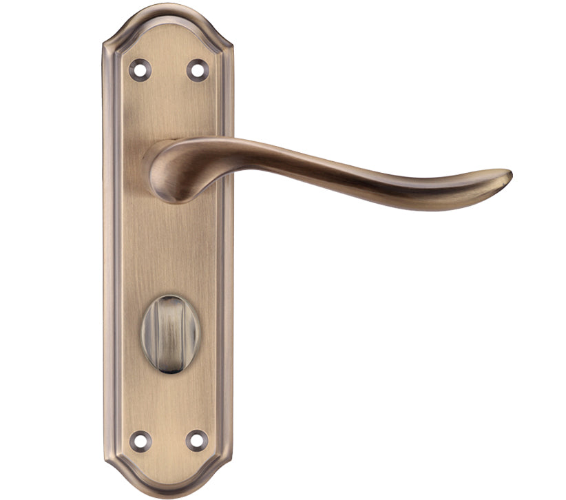 Brass door handle on a white background