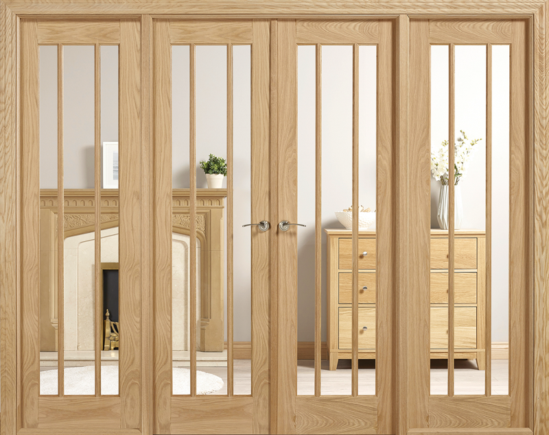 Wooden room divider with glass panels in a room setting