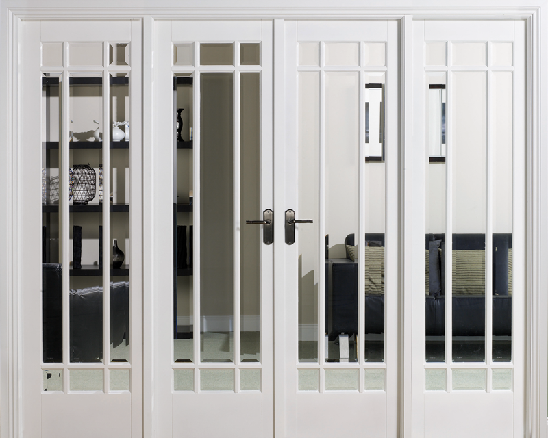White French doors with glass panels leading to a living room.