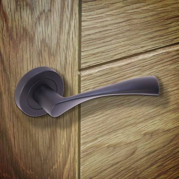 Purple door handle on a wooden door