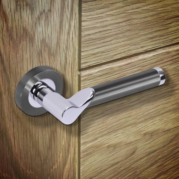 Metal door handle on a wooden door