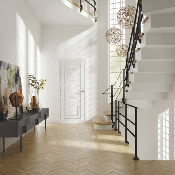 Modern interior with a staircase, console table, and decorative elements.