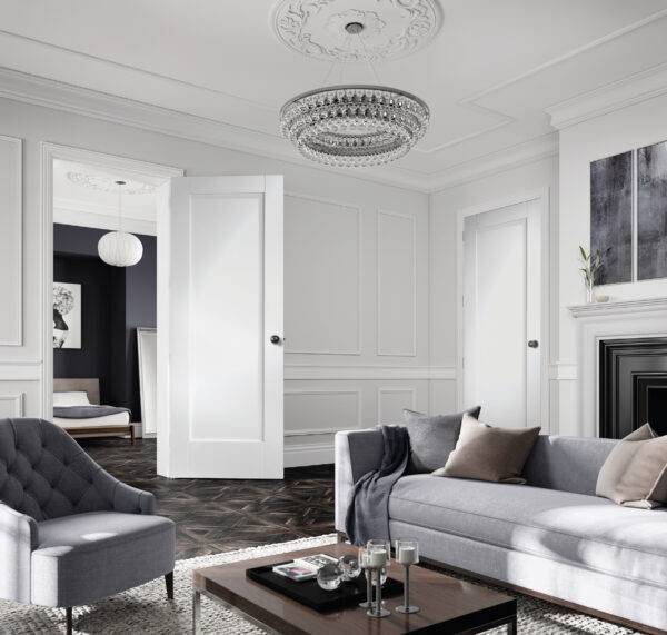 Modern living room with gray sofa, armchair, and coffee table.