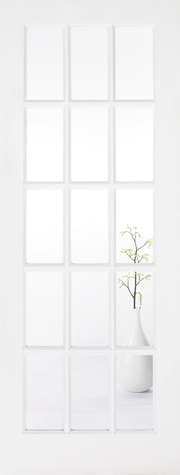 White door with glazed panels and a vase with branches on a white surface.
