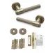 FLARE KNURLED DOOR HANDLE ON ROSE – LOCK PACK – ANTIQUE BRASS