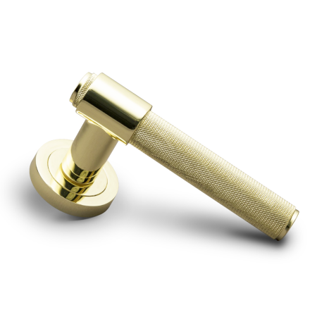 Gold door handle on a white background